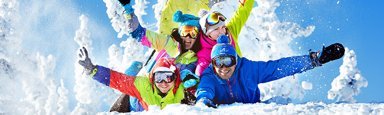 Skiers posing in snow